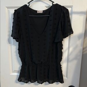 So fuzzy detail peplum top in black. Size large.